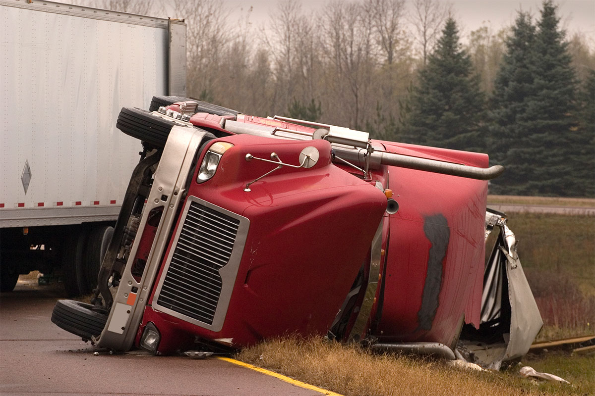 Overturned truck after accident needing an 18-wheeler injury lawyer in Austin
